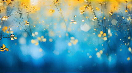 Delicate yellow flowers and branches on a blue blurred background.