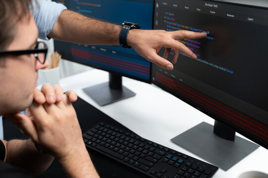 IT developers creating online software development information on screen laptop with coding program in data of application and website. Technical engineer coder on safety program concept. Sellable.