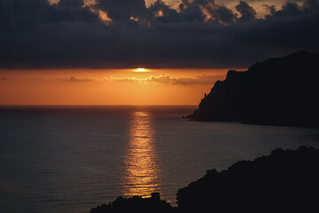 Sunset seen from Ionian Sea coast on near Sinarades village on Corfu Island, Greece