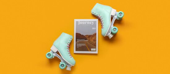 Composition with pair of vintage roller skates and magazine on orange background - obrazy, fototapety, plakaty