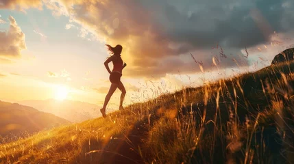 Gartenposter woman is jogging in the mountains in the afternoon © zaen_studio