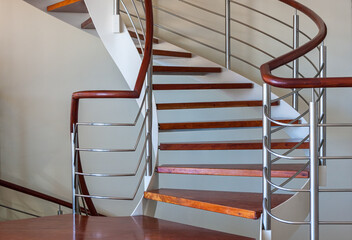 Modern spiral stairway in stainless and wood