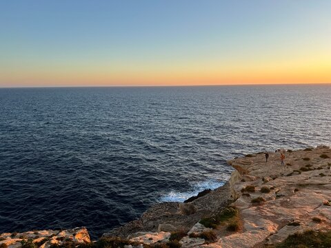 Blue Grotto is a complex of seven caves found along the southern coast of Malta. Wied iz-Zurrieq harbour and Blue Grotto sea caves are located on the coastline opposite to the small  islet of Filfla.