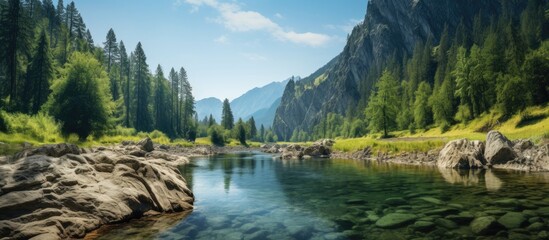 Serene River Flowing Through Majestic Mountain Range in the Wilderness - obrazy, fototapety, plakaty