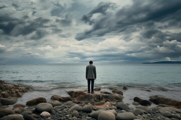 Fototapeta na wymiar Solitary Man standing on shore. Sunrise scenery. Generate Ai