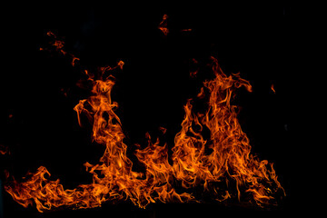 Fire flames on black background. Fire burn flame isolated, abstract texture. Flaming effect with...