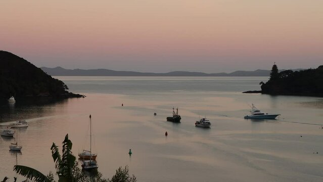 Early morning reflections over Mangonui in New Zealand North Island.