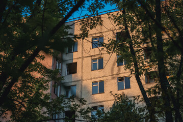 Fototapeta na wymiar Residential building in Pripyat ghost city in Chernobyl Exclusion Zone, Ukraine