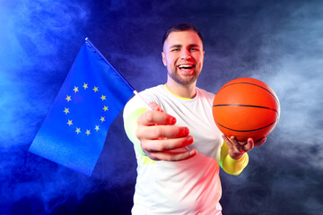 Male basketball player with flag of European Union on dark background