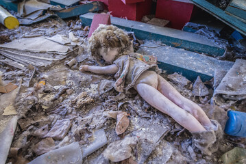 Old doll in Kindergarten No. 10 Cheburashka in Pripyat ghost city in Chernobyl Exclusion Zone, Ukraine - obrazy, fototapety, plakaty