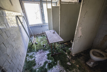 Toilets in Middle School No. 3 in Pripyat ghost city in Chernobyl Exclusion Zone, Ukraine