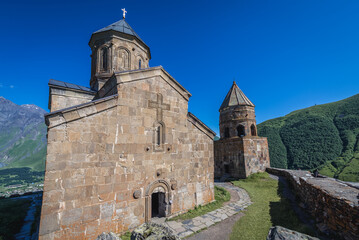 Fototapeta na wymiar Tsminda Sameba - Trinity Church in Caucasus Mountains in Gergeti village near Stepantsminda, Georgia