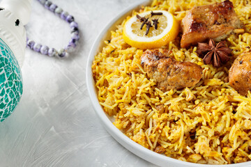 Pakistani and Indian Chicken Biryani Rice with Spices on White Plate, Ramadan Food