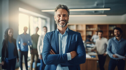 Smiling businessman standing in front of team in the office - Powered by Adobe