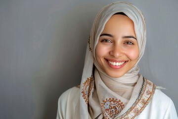 Portrait of islamic woman smiling. Pretty muslim girl. Beautiful asian muslimah woman model posing on grey wall studio. Portrait Of Arab Beauty, copy space - generative ai