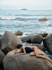 Fototapeta na wymiar Summer Beauty: A Happy, Attractive Woman Posing in Sexy Swimwear on a Tropical Beach