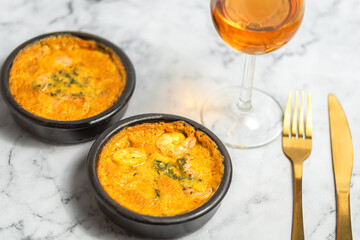 Scampi pan in curry sauce, Scampi baked in curry sauce, dish with shrimps on marble background, food photo