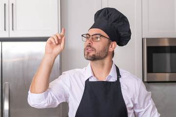 Idea for food. Chef on kitchen. Professional chef man in uniform on kitchen. Chef, cook or baker....