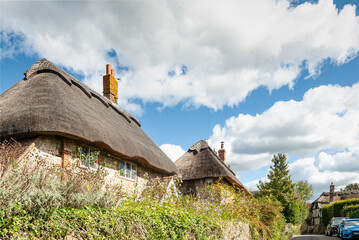 Picturesque scenes from the English countryside. Thatched roof houses, a charming feature of traditional English architecture in Amberley quint village.