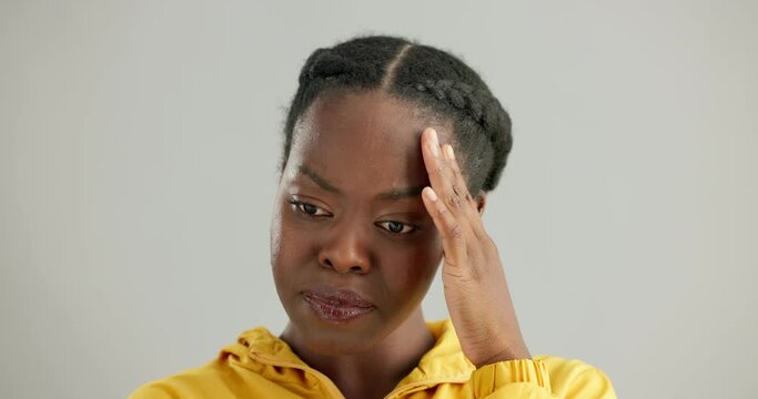 Face, Embarrassed And Reaction With Awkward Black Woman In Studio On White Background For Emotion. Portrait, Frown And Shy With Young Person Feeling Ashamed, Guilty Or Uncomfortable By Confusing News