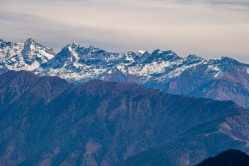 Stark Contrasts: Snow-Capped Ridges Overlooking Murma Top, Nepal