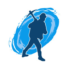 Silhouette of a man in worker costume carrying pick axe tool in action pose. Silhouette of a miner in action pose with pick axe tool.