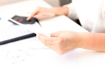 woman investment consultant analyzing company annual financial report balance