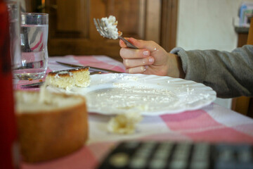 a young boy eating Epiphany cake