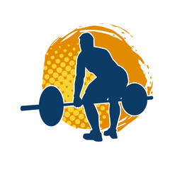 Silhouette of a muscular male in weight lifting pose at the gym. Silhouette of a muscular man in workout pose lifting barbell.