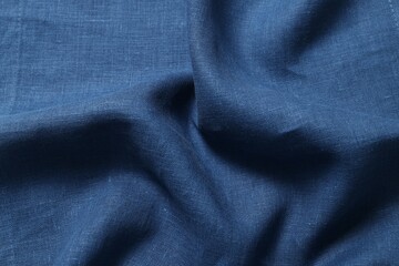Obraz premium Texture of blue crumpled fabric as background, closeup