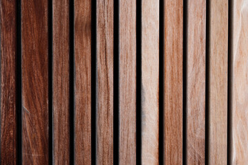 Close up view of wooden beams with different textures and colors. Varying shades and textures of material. Concept of decoration and symmetrical background