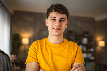 Portrait of young caucasian teen male young man stand at home