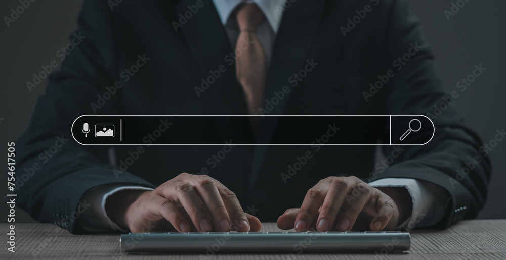Wall mural businessman's hands are finger point to searching for information. using laptop with your website. d