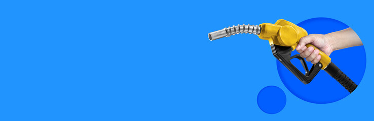 Hands holding Fuel nozzle on blue background
