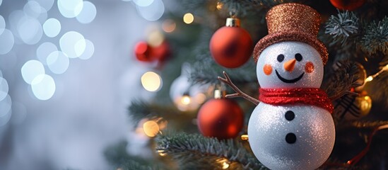 A close-up view of a snowman ornament hanging from a Christmas tree, blending in with other festive...