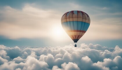 Fototapeta premium Hot air balloon rises very high in blue sky above white clouds bright sun shines