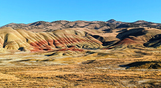 Painted Hills landscape, central Oregon, pumice and ash from volcanic eruptions in the Cascade Mountains traveled 100 miles east and settled over the area.