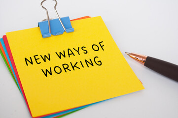 New ways of working text on yellow notepad. New normal concept