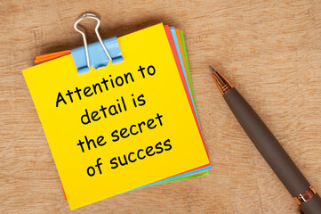 Attention to details is the secret of success text on yellow notepad. Encouragement concept. - obrazy, fototapety, plakaty