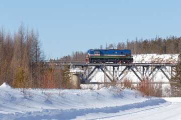 Diesel locomotive on a railway bridge