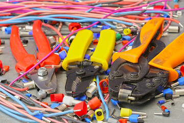 Electrical installation tools for installation of electrical panels. On a metal surface. Close-up.