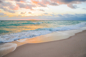Amazing sunrise horizon, soft sky, turquoise sea waves