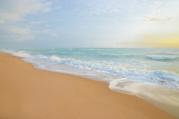 Fototapeta na wymiar Amazing sunrise horizon, soft sky, turquoise sea waves
