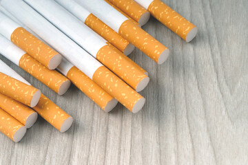 peel it off cigarette two pack prepare smoking on the wooden. Packing line up. photo filters Natural light. soft focus. Leave space to write a description of the message.