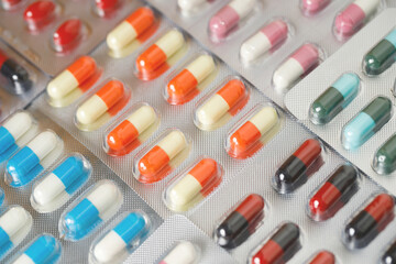 close up pharmaceuticals antibiotics pills medicine in blister packs. colorful antibacterials pills Pharmacy background. capsule pill medicine Antimicrobial drug resistance. Pharmaceutical industry