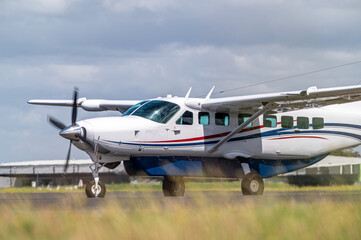 Cessna light aircraft taxiing at an airport