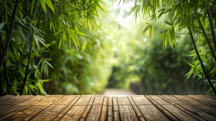 Poster background view of a bamboo forest with a bamboo wooden table in © pasakorn