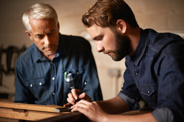 Man, dad and coach with wood, workshop and family business or apprenticeship. Father, adult son and design with artisan, carpentry and together for startup or mentor with learning and working - obrazy, fototapety, plakaty