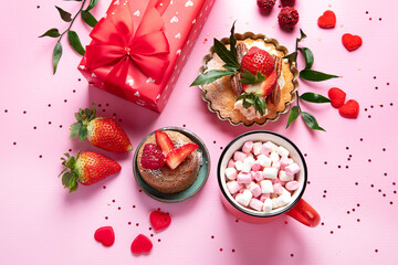 Festive pink background with cupcake, strawberries, chocolates, hot drink. Birthday celebration