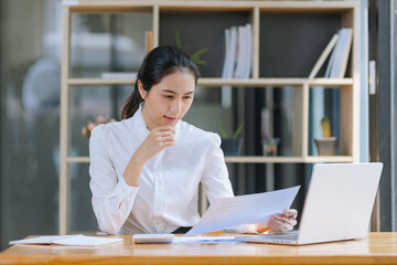Business financial analytics data advisory concept. Businesswoman working on digital laptop computer with advisor showing plan of investment to clients at table office, Business marketing.
